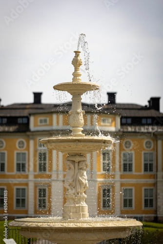Picturesque fountain situated in front of the majestic Steningehojden Slottsby