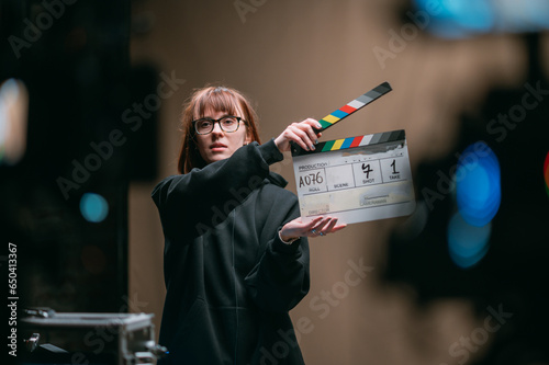 Assistant director with clapperboard on set. Close-up of firecrackers for filming a movie