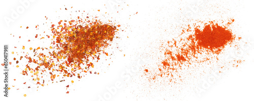 Fotografia Crushed red cayenne pepper, dried chili flakes and ground minced paprika pile is