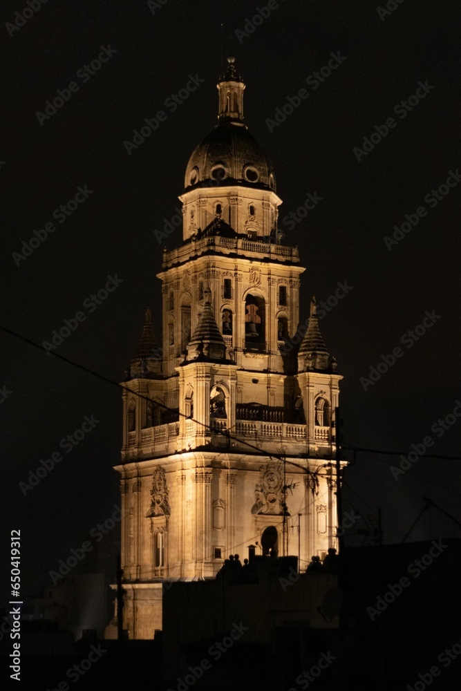 Stunning nighttime image of the Murcia Cathedral, illuminated by the lights of the city
