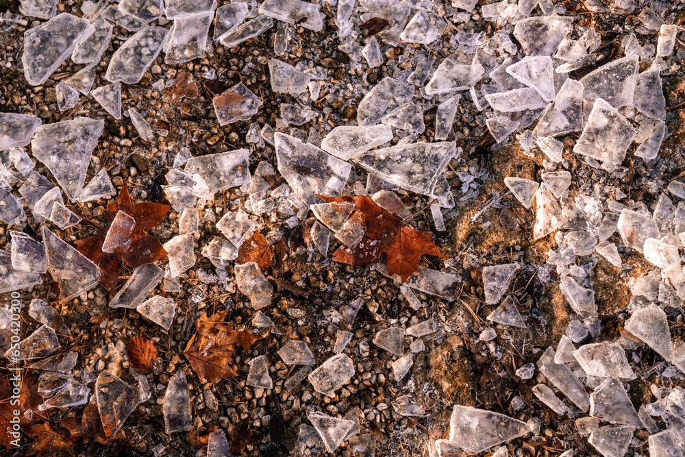 ice chunks on the ground on the ground is a light brown, yellow and red