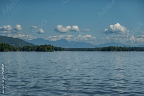 Picturesque view of New Hampshire s Lake Winnipesaukee with the Mountains in the backdrop