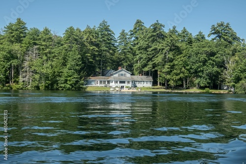 Fototapeta Naklejka Na Ścianę i Meble -  Picturesque lake house in front of the peaceful waters of Lake Winnipesaukee, New Hampshire