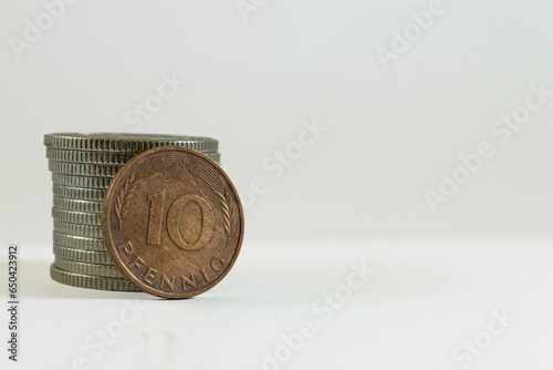 Closeup image of a German Western Mark Pfennig coin on a white background photo