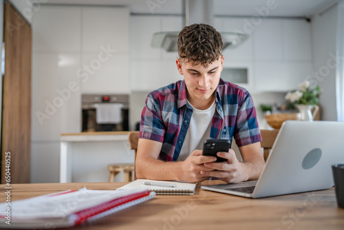 Young caucasian man teenager student study at home