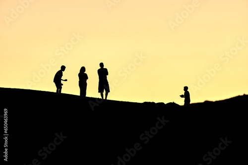 Hilltop Harmony: Family Silhouettes © RootX
