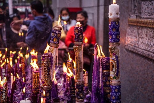 group of handmade and ornamental candles lit by the Lord of Miracles in Lima, Peru