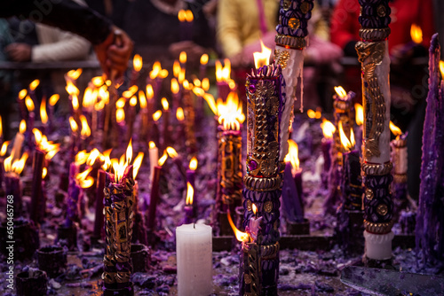 group of handmade and ornamental candles lit by the Lord of Miracles in Lima, Peru