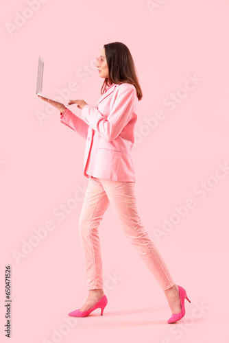 Young woman in stylish suit...