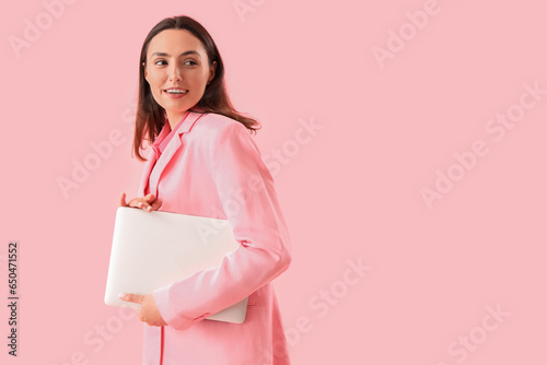 Young woman in stylish suit...
