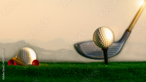 Close-up of a golf ball on the hitting platform Golf ball on red hitting platform on green grass Sports that people around the world play during holidays for health and business deals. concept  sport 