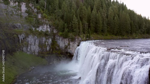Drone Aerial of the Upper Mesa Falls, a thunderous curtain of water – as tall as a 10-story building  Near Island Park, and Ashton,  Idaho photo