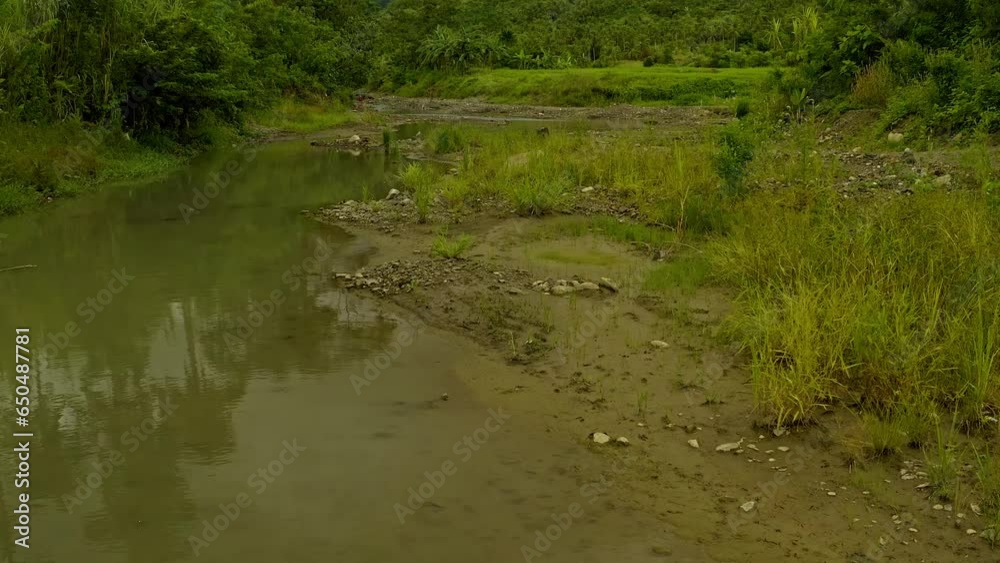 Climate change causes low river levels on the Surigao River Philippines after a prolonged dry season. Climate change causes low river levels on the Surigao River Philippines after a prolonged dry season.