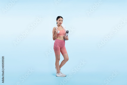 Athletic and sporty asian woman resting and drink water after intensive cardio workout training. Healthy exercising and fit body care lifestyle pursuit in studio shot isolated background. Vigorous