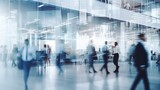 Blurred business people in white glass office background.