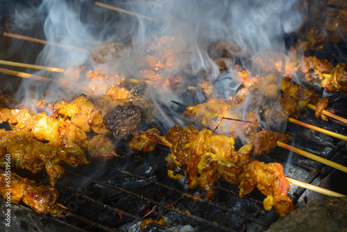 Close up shot of roasted goat satay, a popular dish in Indonesia.