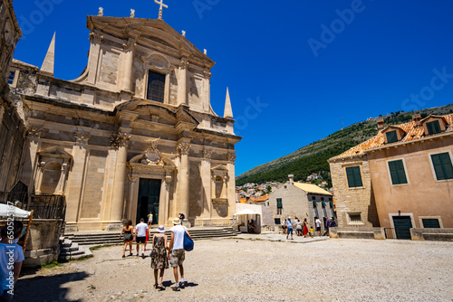 tourists travel through the historic city streets in Dubrovnik Old Town, Croatia, medieval European architecture