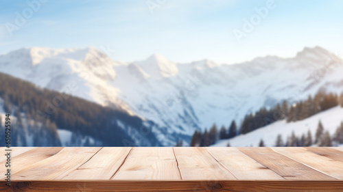 empty wooden table top board on blur snow mountain background © piggu