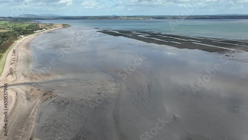 Aerial fly past of Woodstown beach and Oyster Beds at low tide on a warm sunny autumn day photo