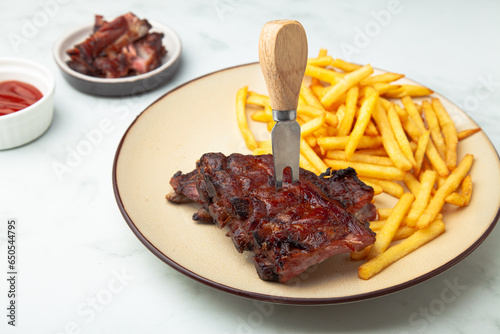 Pork ribs bbq with fries and ketchup