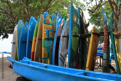 Couple of colorful surf boards in a row on the beach of Bali, Kuta. photo