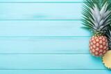 Tropical summer banner with ripe pineapple, beach sea life objects, and pastel mint blue wooden background. Generative AI