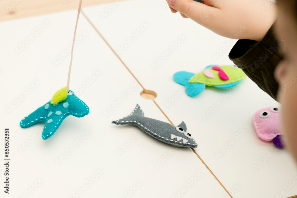 Hand made stuffed felt toy. Fishing rod with and fishes or other