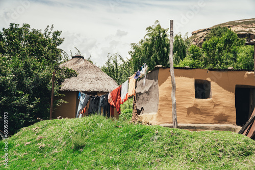 A washing line and traditional huts built with natural materials in a small African village in the alpine country of Lesotho. photo