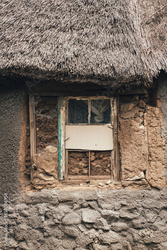 A traditional hut built with natural materials in a small African village in the alpine country of Lesotho. photo