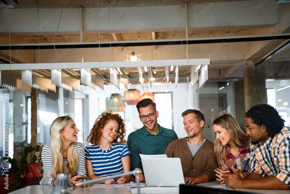 Successful multiethnic group of designers, architects, business people at work in office Successful multiethnic group of designers, architects, business people at work in office