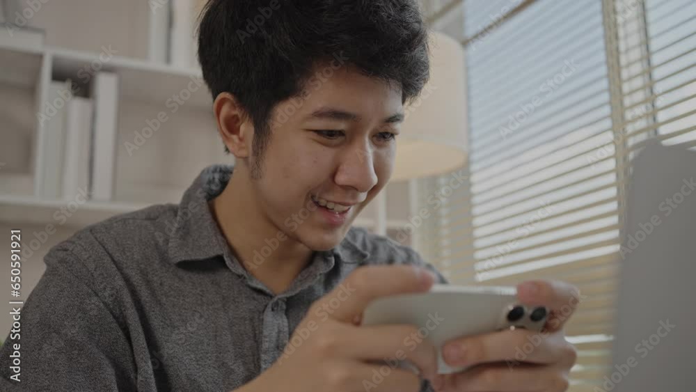 Elation and Ecstasy, Man Celebrating Victory in Mobile Gaming, Joy While Winning a Smartphone Game, Happy Gamer Achieves Victory on Smartphone. Elation and Ecstasy, Man Celebrating Victory in Mobile Gaming, Joy While Winning a Smartphone Game, Happy Gamer Achieves Victory on Smartphone.