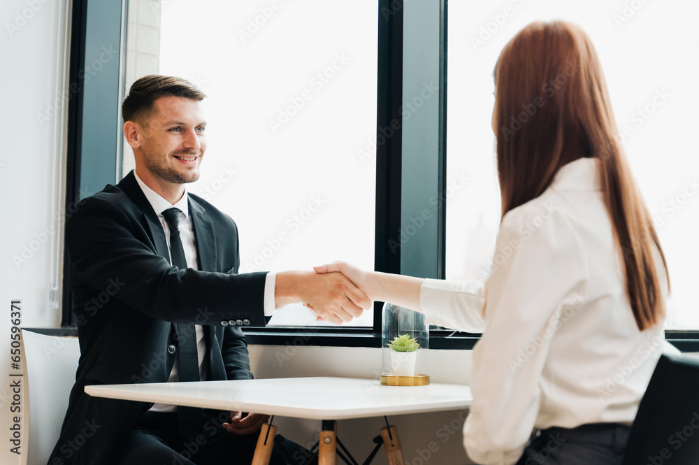  Businessman handshake in the office.