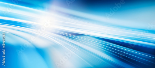 An abstract background of blue and white lines and streaks of light-energy. Sense of motion and speed. The image has a futuristic and technological feel to it.