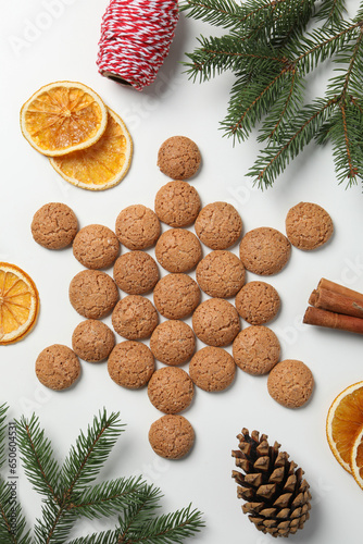 Delicious, Dutch Pepernoten Christmas cookies with a Christmas tree branch