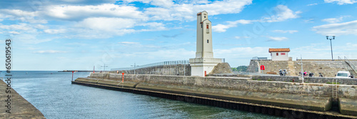 Downstream port alignment lighthouse in the port of Saint-Jean-de-Luz, France photo