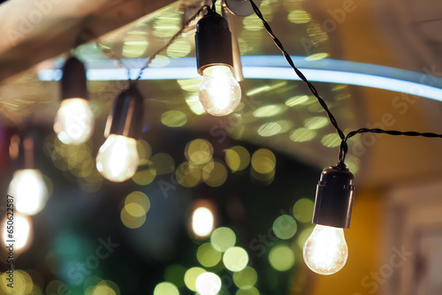 Turned on lamps and Christmas lights at night, festive mood