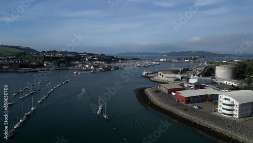Plymouth, Devon, England: DRONE VIEWS: River Plym: Riverside warehouses, factories, docks and yacht moorings; Mount Batten, Drake's Island & Plymouth Sound on the horizon. Plymouth is a busy UK port.