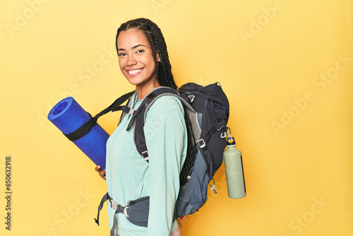 Indonesian hikker isolated on yellow background photo