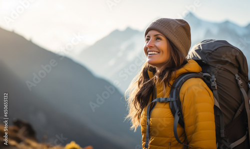 Female hiker traveling, walking alone in autumn mountains under sunset, Travel, adventure, relax, recharge concept.  © Andrii IURLOV