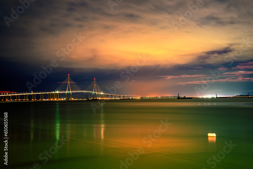 Incheon Bridge or Incheon Daegyo Expressway over the Yellow Sea at night in South Korea, linking Yeongjong Island with the mainland, built in multi-sections to withstand earthquakes