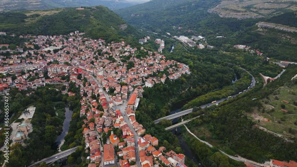 An aerial view of Veliko Tarnovo reveals a Bulgarian city rich in history and culture, with its beautiful buildings, streets, and picturesque hills. An aerial view of Veliko Tarnovo reveals a Bulgarian city rich in history and culture, with its beautiful buildings, streets, and picturesque hills.