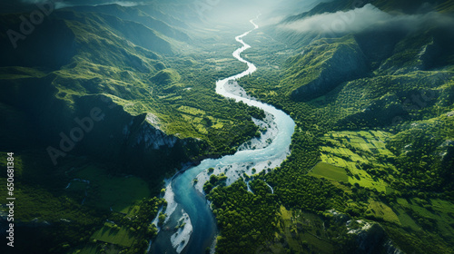 a beautiful bird's eye view of a winding river amidst green forest and hills © MYKHAILO KUSHEI