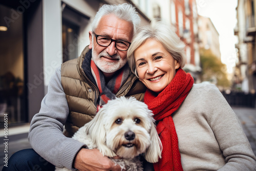 Romantic senior couple with their dog in the street