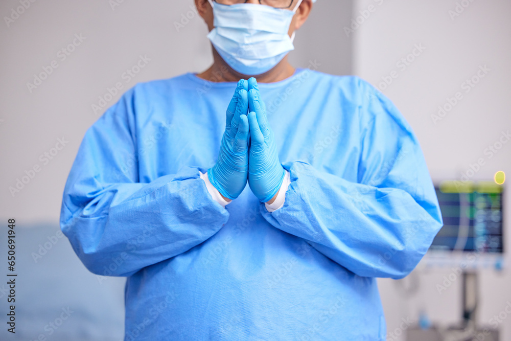 Fototapeta premium Doctor, praying and hands with healthcare and surgery, seek guidance from God and worship, hope and operation room. Surgeon person in theatre, prayer and respect with plea, health and ask for help