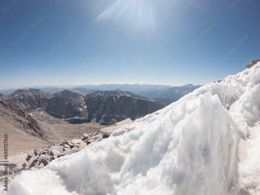 Close up of snow remnants on path to White Mountney through tops in Sierra Nevada, America