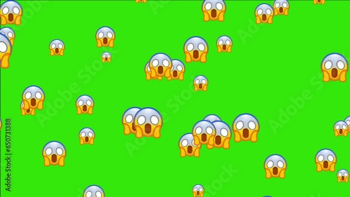 Screaming in fear emoji. Horror and fright emoticon. Face with blue forehead, big scared eyes and long, open mouth. Animated falling emojis. Social media icons symbol animation with green screen backg