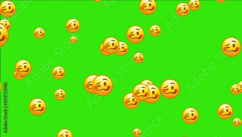 Confounded emoji. Confused emoticon with jagged mouth. Yellow face emoji. Animated falling emojis. Social media icons symbol animation with green screen background.