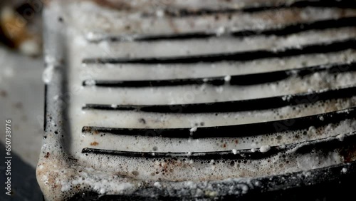 Cleaning the tray of a coffee