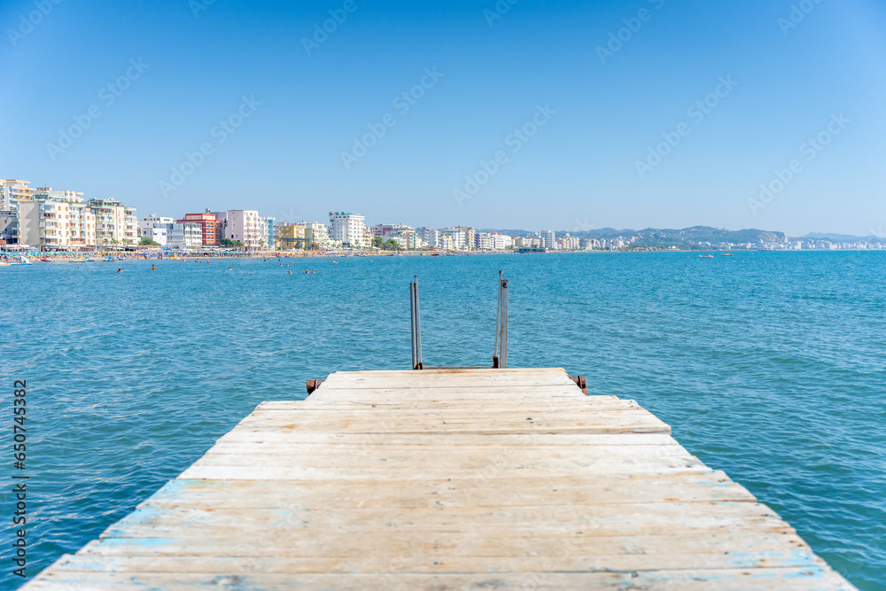 Wooden pier over looking the coastline of Durres Albania in the Summer