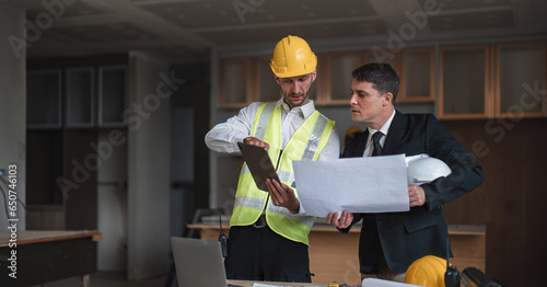 Diverse Team of Specialists Use Laptop on Construction Site. Real Estate Building Project with Engineer Investor and Businessman Checking Area, working on Civil Engineering, Discussing Strategy Plan